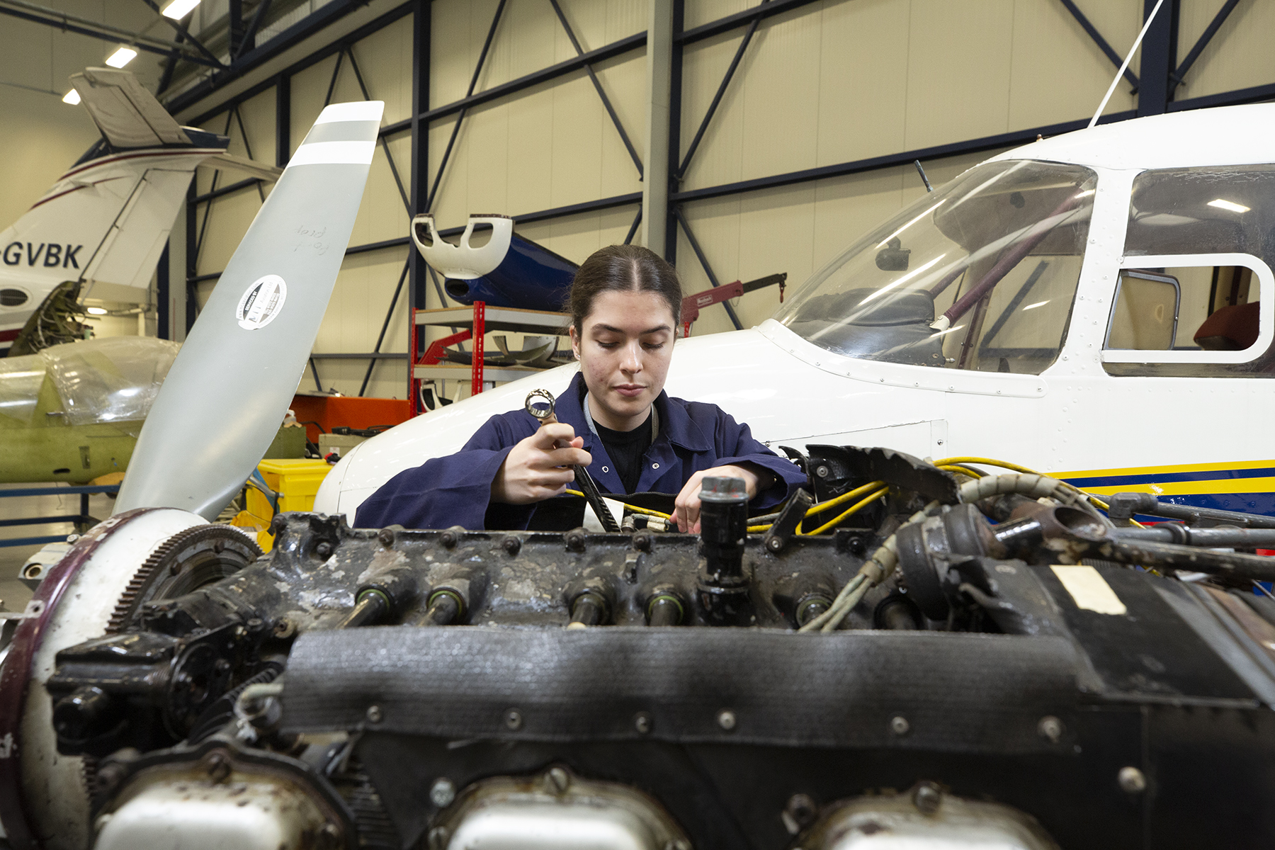 Student Working On Engine Wide Background